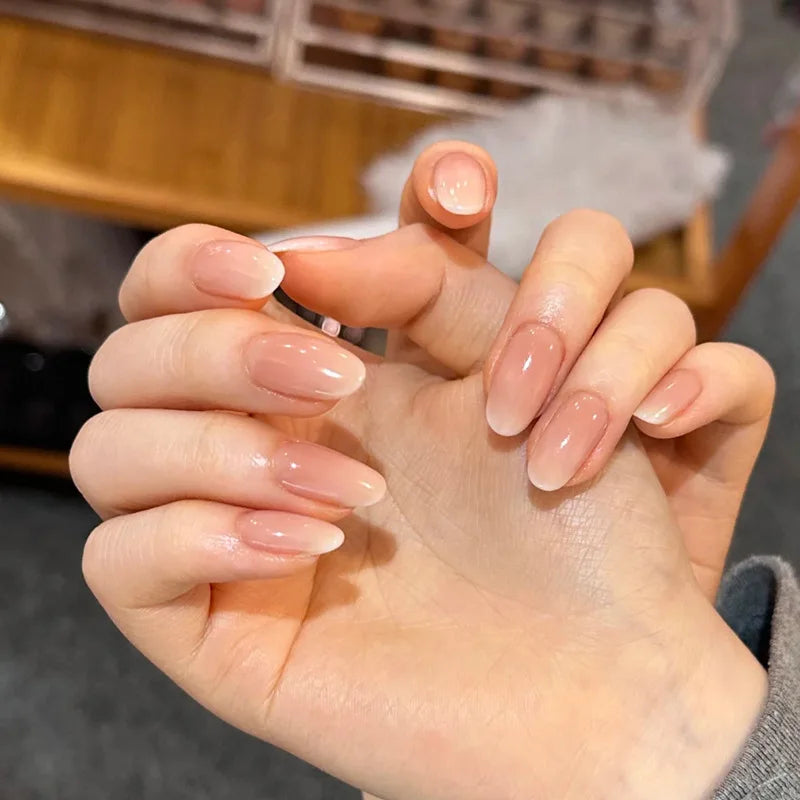 24Pcs Short Oval Head Blush Pink Press on Nails with Simple Designs Almond Nails Wearable Acrylic Full Cover Nail Tips with Glue